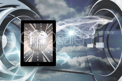 Composite image of silver globe on tablet screen