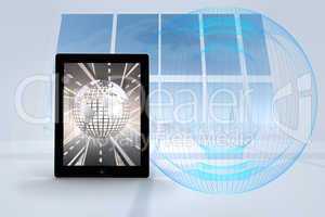 Composite image of silver globe on tablet screen