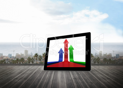 Composite image of arrows on tablet screen