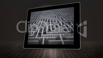 Composite image of maze on tablet screen