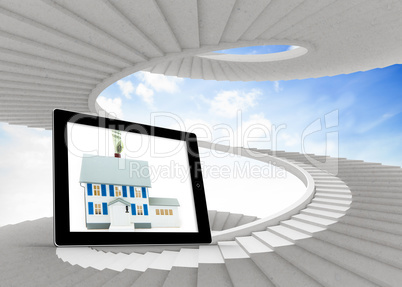 Composite image of house with price tag on tablet screen