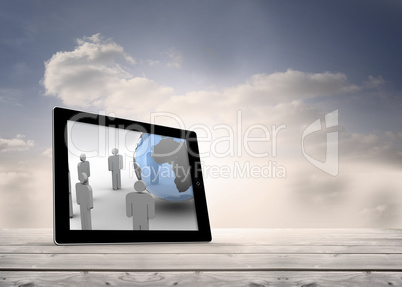 Composite image of figures and earth on tablet screen