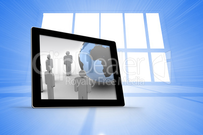Composite image of figures and earth on tablet screen Composite image of figures and earth on tablet screen