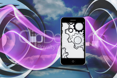 Composite image of cogs and wheels on smartphone screen Composite image of cogs and wheels on smartphone screen