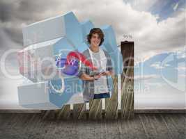 Composite image of student with tablet on abstract screen