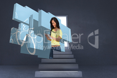 Composite image of student using tablet on abstract screen