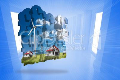 Composite image of houses with wind turbines on abstract screen