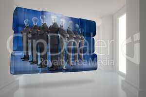 Composite image of light bulb business people on abstract screen