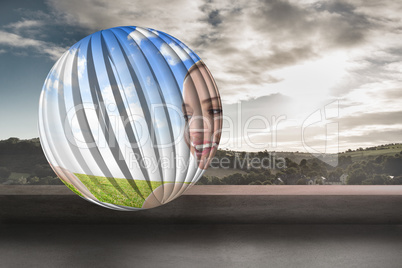 Composite image of smiling woman in field on abstract screen