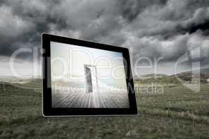 Composite image of open door on tablet screen