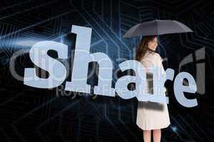 Businesswoman holding umbrella behind the word share
