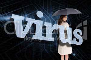 Businesswoman holding umbrella behind the word virus