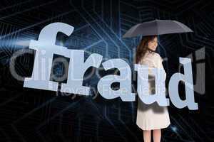 Businesswoman holding umbrella behind the word fraud