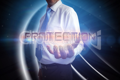 Businessman presenting the word protection