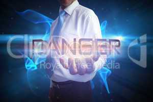 Businessman presenting the word danger