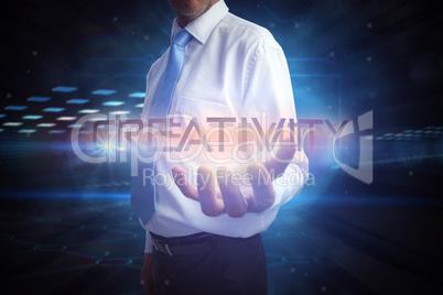 Businessman presenting the word creativity
