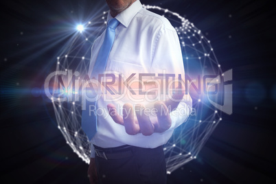 Businessman presenting the word marketing