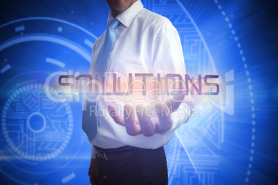 Businessman presenting the word solutions