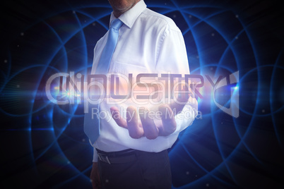 Businessman presenting the word industry