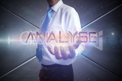 Businessman presenting the word analyse
