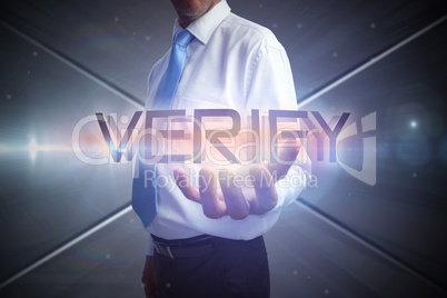 Businessman presenting the word verify