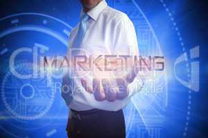 Businessman presenting the word marketing