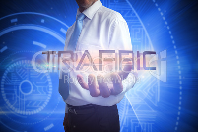 Businessman presenting the word traffic