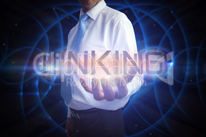 Businessman presenting the word linking