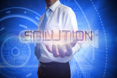 Businessman presenting the word solution