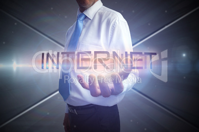 Businessman presenting the word internet