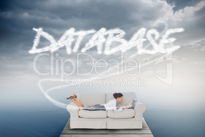 Database against cloudy sky over ocean
