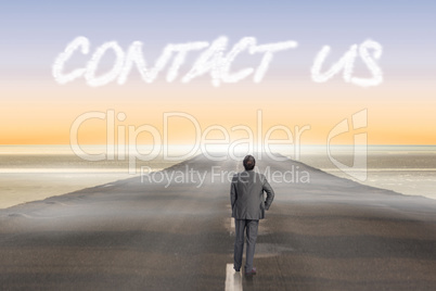 Contact us against road leading out to the horizon