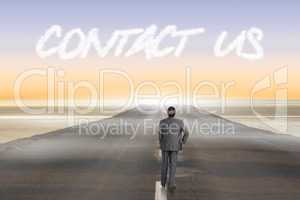 Contact us against road leading out to the horizon