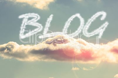 Blog against bright blue sky with cloud