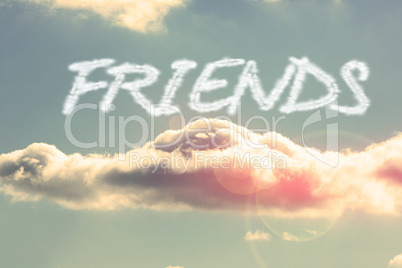 Friends against bright blue sky with cloud