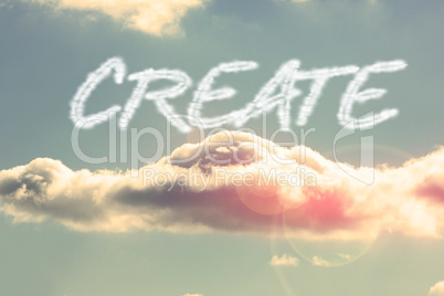 Create against bright blue sky with cloud