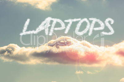 Laptops against bright blue sky with cloud