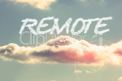 Remote against bright blue sky with cloud