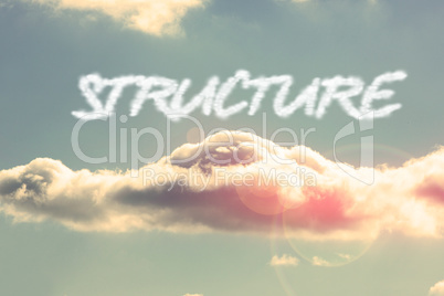Structure against bright blue sky with cloud