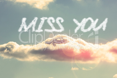 Miss you against bright blue sky with cloud
