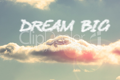 Dream big against bright blue sky with cloud