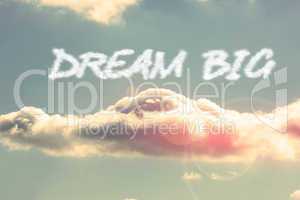 Dream big against bright blue sky with cloud