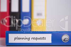 Planning requests on blue business binder