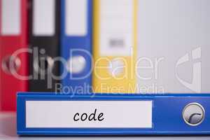 Code on blue business binder
