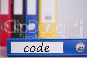 Code on blue business binder
