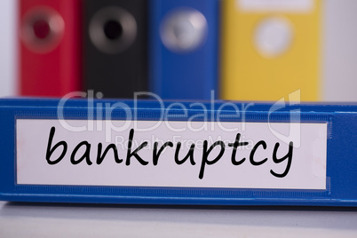 Bankruptcy on blue business binder