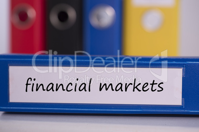 Financial markets on blue business binder