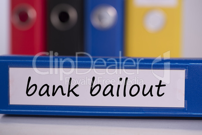 Bank bailout on blue business binder