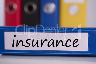 Insurance on blue business binder