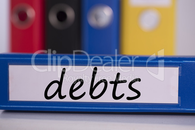 Debts on blue business binder